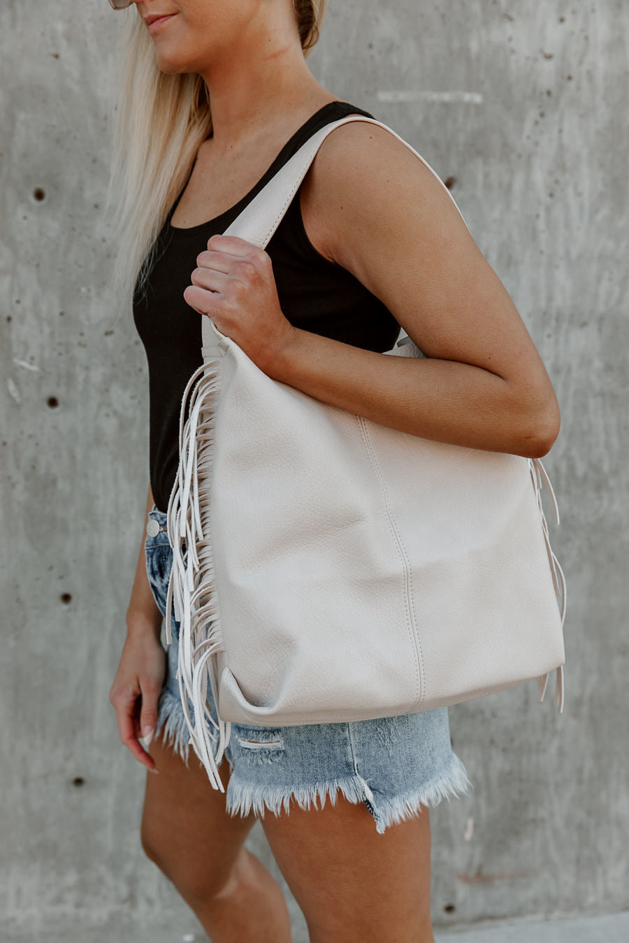 Cream Vegan Leather Fringe Tote - On Model Side View | Gameday Couture - SOHO