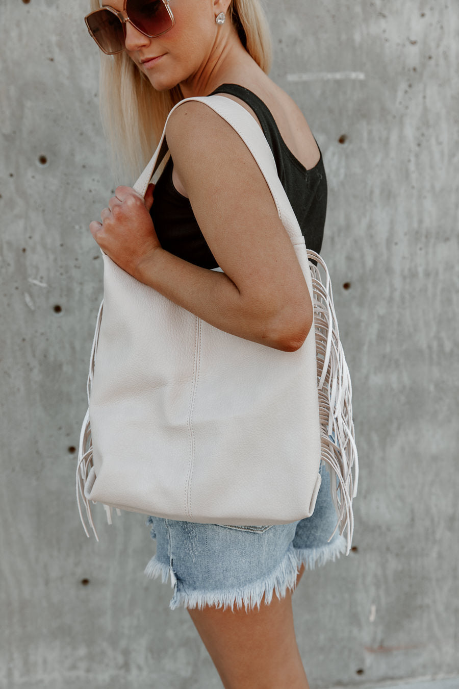 Cream Vegan Leather Fringe Tote - On Model Side Angle | Gameday Couture - SOHO