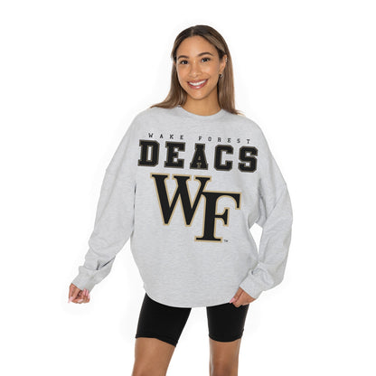 WAKE FOREST DEMON DEACONS BIG GOALS RELAXED FIT HEATHERED LONG SLEEVE FRENCH TERRY PULLOVER WITH RIBBED CUFF AND NECKLINE DETAIL