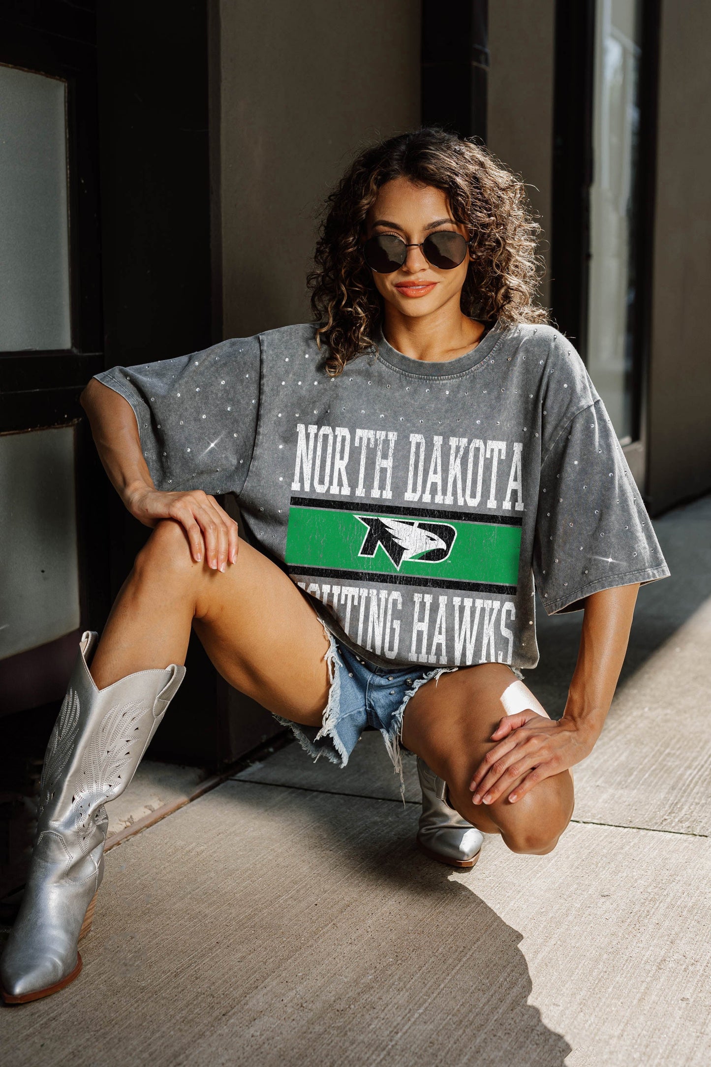 NORTH DAKOTA FIGHTING HAWKS ON THE BALL OVERSIZED ALL-OVER MINI RHINESTONE SHORT SLEEVE CLASSIC TEE WITH RIBBED NECKLINE